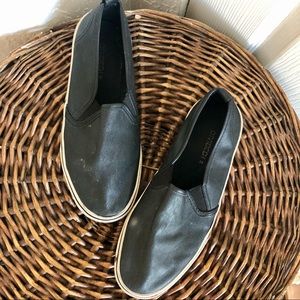 Black faux leather slip on sneakers